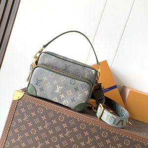 • Monogram Heritage coated canvas • Calf leather trim • Fabric lining • Metal hardware • Zipper closure • Zippered front pocket • Main compartment • Interior patch pocket • Shoulder strap: Detachable, adjustable • Strap half-length: 49.0 cm • Strap half-length adjustable to: 59.0 cm • Handle: Single handle, detachable